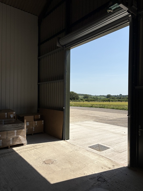 Morvan-warehouse-open-door-hampshire-countryside Morvan-warehouse-open-door-hampshire-countryside-view